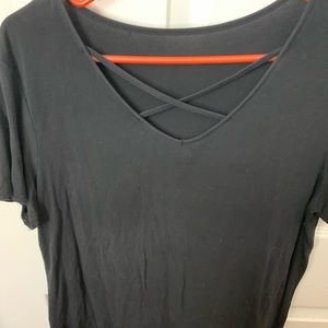 Black shirt with criss cross detail in the front. Super cute and super comfy!!